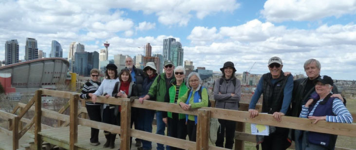 An Urban Walking group uses the source book Calgary’s Best Hikes and Walks, by Lori Beattie, to plan their in-town adventures.