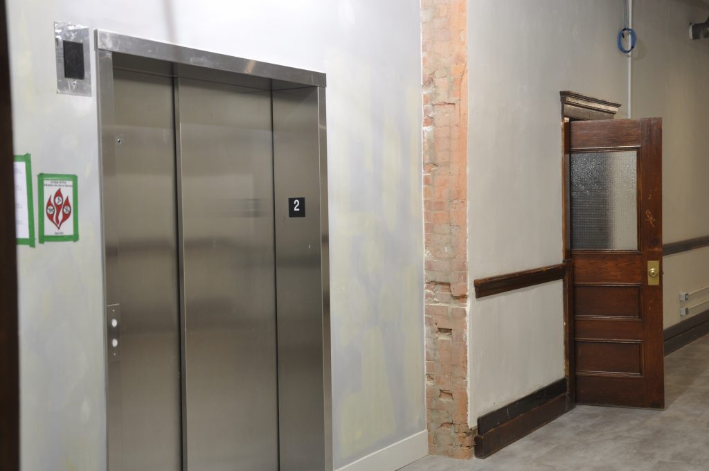 Slivers of character-rich brick are highlighted throughout the school adding a tactile experience to this historical space.