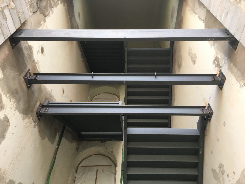 First the steel columns and stringers, platforms and threads for our new concrete stairs were installed. Then steelwork began on the new facade portions of this entrance, signalling how contemporary architecture will be sutured between the historic fabric of brick and sandstone.